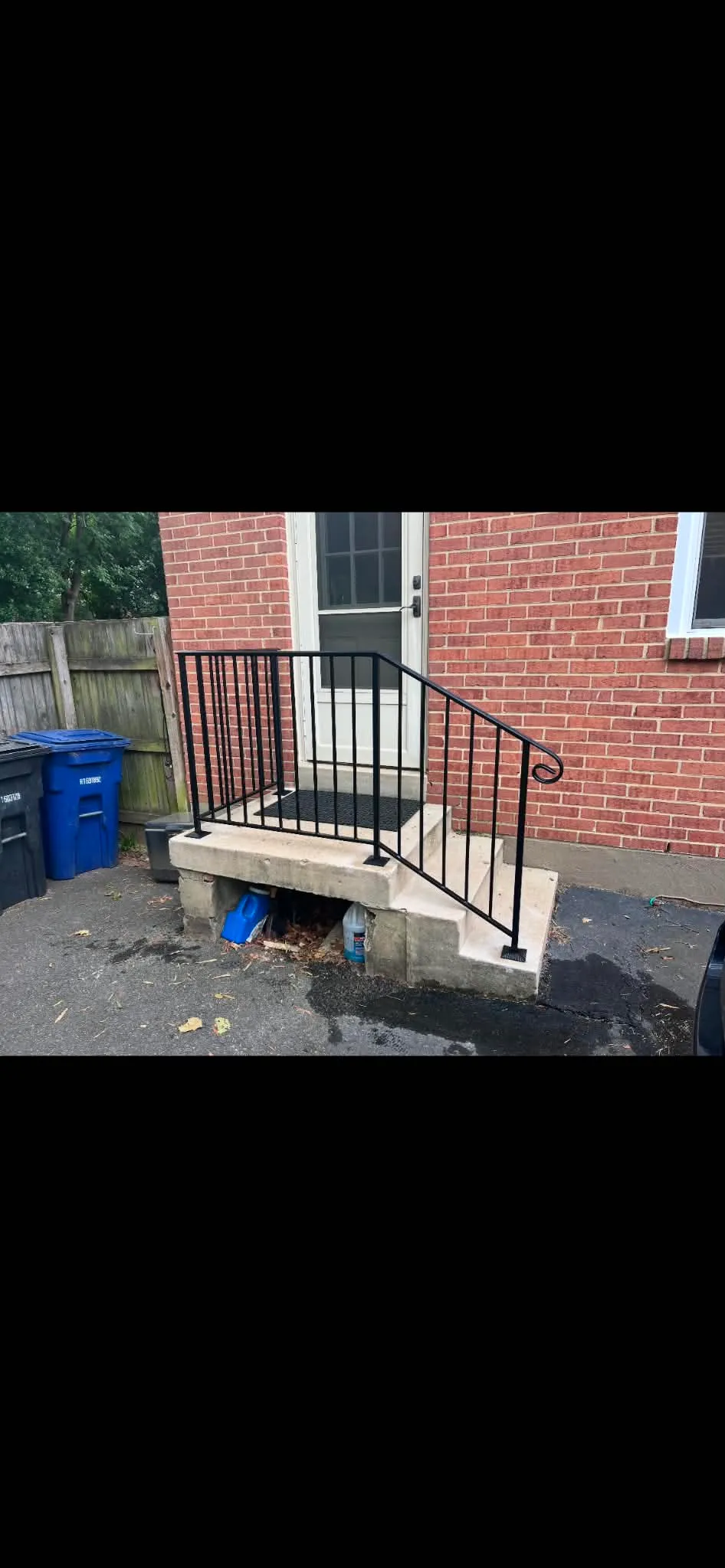 Residential Backyard Concrete Step Metal Handrail